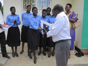 Jacinta Lakaraber, the head girl is hapily receiving the keys to the AR newly completed Dormitory from the Principal.
