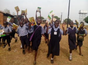 Kitgum Demo Pupils Celebrate text books