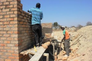 building walls to boys' latrines